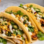 Crazy Good Street Corn Chicken Tacos with Avocado Salsa